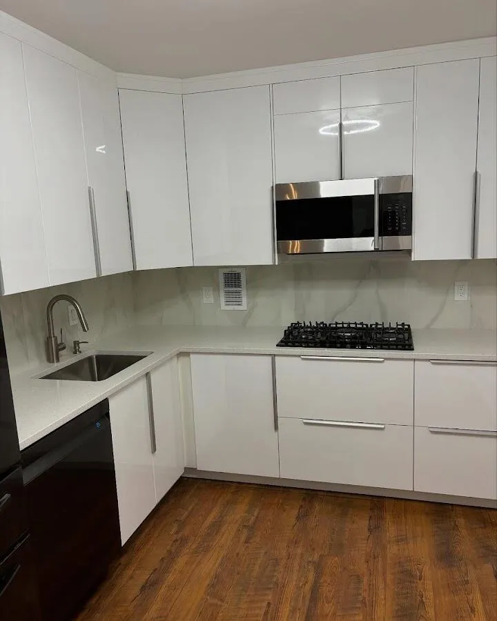 Restored kitchen with white cabinets after water damage in Roseland